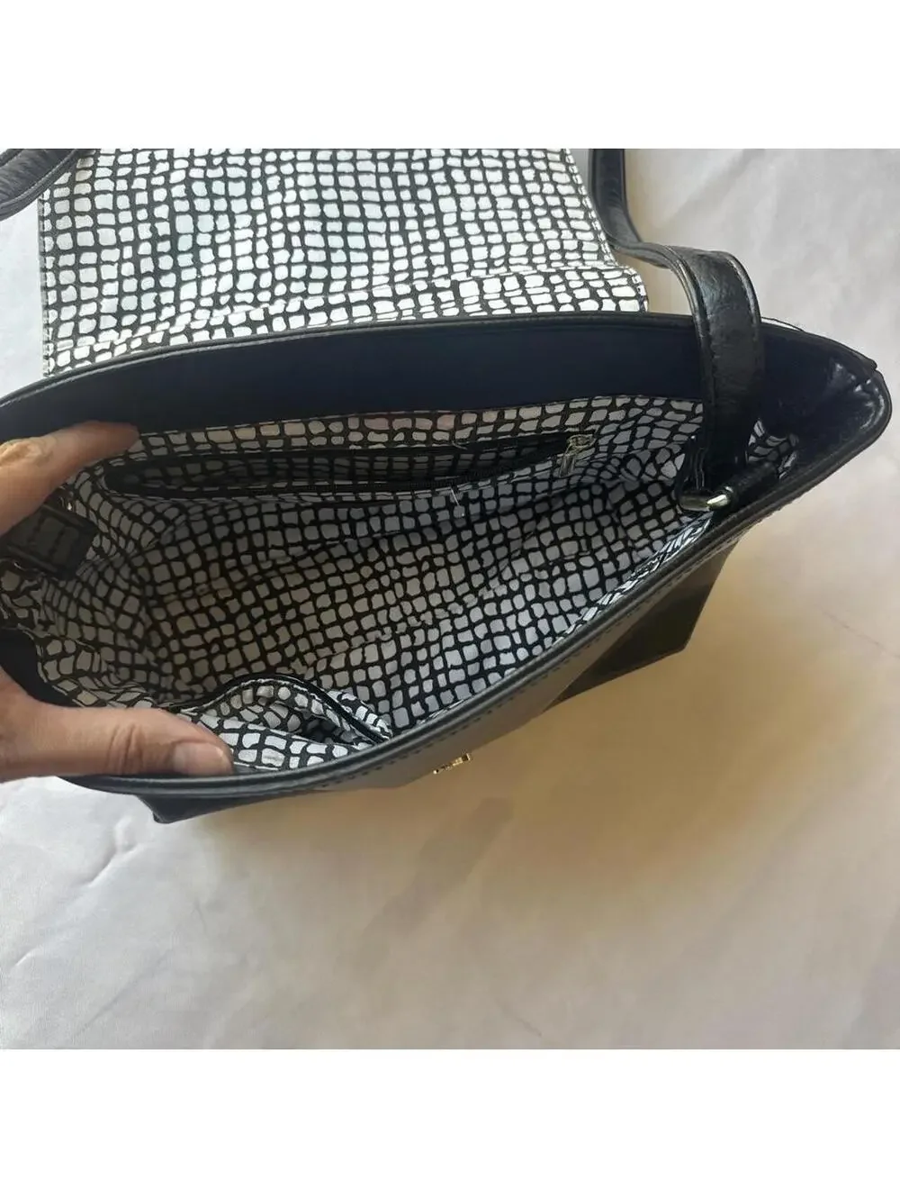 Black Faux Leather Shoulder Bag with Metal Accent and Patterned Interior